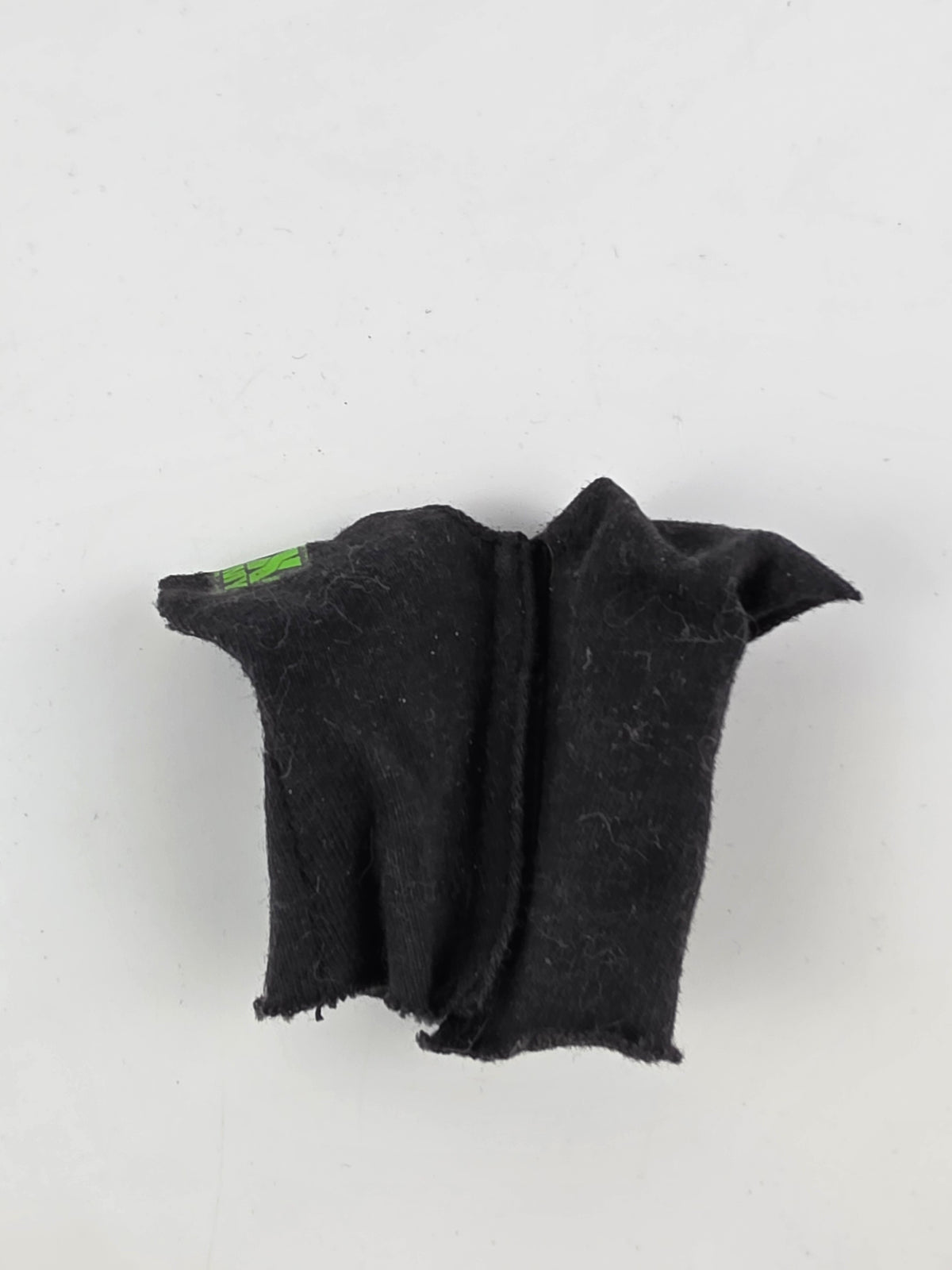 miniature D-Generation X shirt or cloth accessory from a WWE action figure,