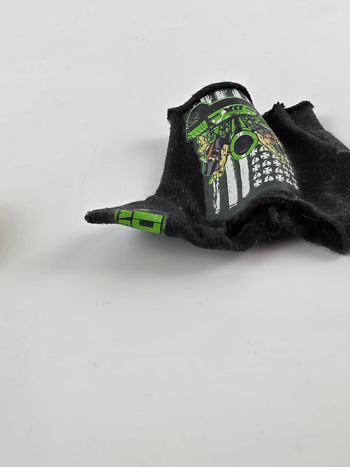 miniature D-Generation X shirt or cloth accessory from a WWE action figure,